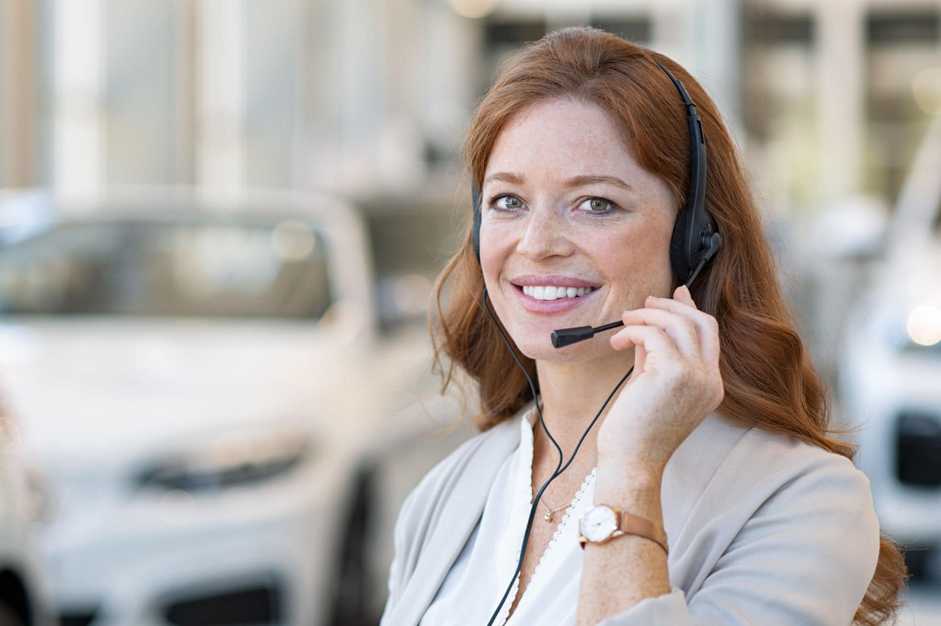 beautiful,customer,support,wearing,headset,and,looking,at,camera.,portrait